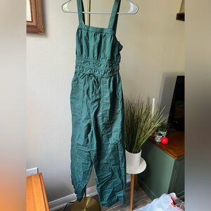 Green/blue romper with zipper and adjustable straps